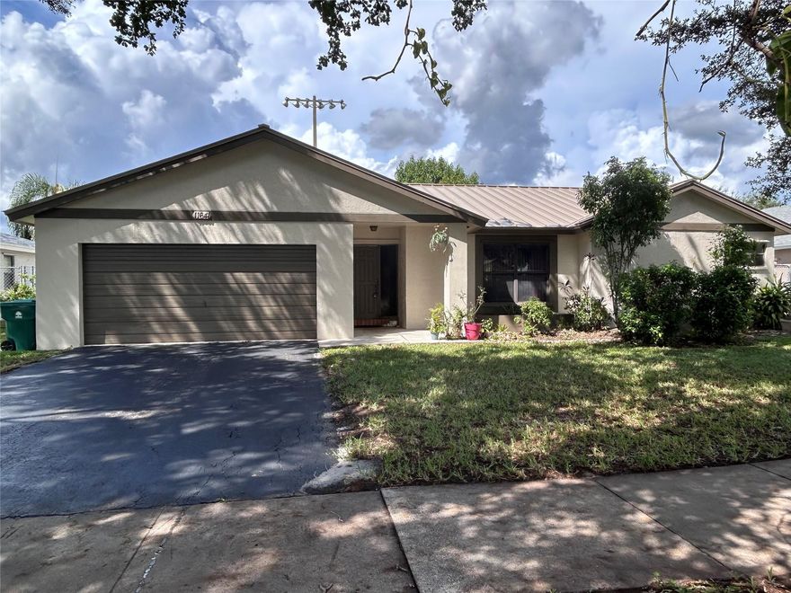 Welcome to this 3-bedroom, 2-bath home located in the highly desirable Flamingo Gardens neighborhood. Nestled in a community known for its top-rated schools, this property offers both comfort and convenience and NO HOA! Recent upgrades include a new metal roof, new water heater, new electrical panel, and fresh exterior paint. The spacious yard is a true highlight, featuring a variety of fruit-bearing trees—Carambola (Starfruit), Avocado, Pomegranate, Coconut Palm, and Banana plant. Just steps away from Griffin Elementary School, Bill Lips Sports Complex, shopping, dining, and more!  Don’t miss the opportunity to make this home yours in one of the most sought-after neighborhoods!