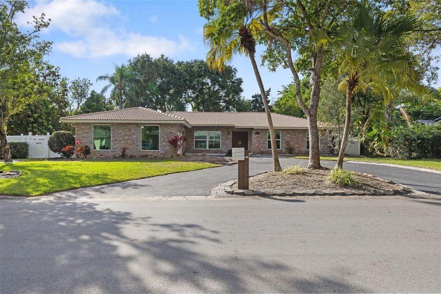Stunning corner-lot home in the heart of Coral Springs’ highly sought-after Maplewood community with no HOA! Set on an oversized 15,000+ sq ft lot, this 4-bedroom residence with a den and 3 Full bathrooms delivers a bright, open floor plan with upgraded kitchen and bathrooms, cozy fireplace, and effortless indoor-outdoor living. The backyard is a true highlight—featuring a sparkling private pool, covered patio for entertaining, and plenty of space for gatherings or relaxation. Impact windows throughout, new water heater, upgraded electrical system, circular driveway, and a newly coated 2-car garage add peace of mind and convenience. Ideally located in a top-rated school district and close to shopping, dining, and major roadways—this home checks every box for South Florida living.