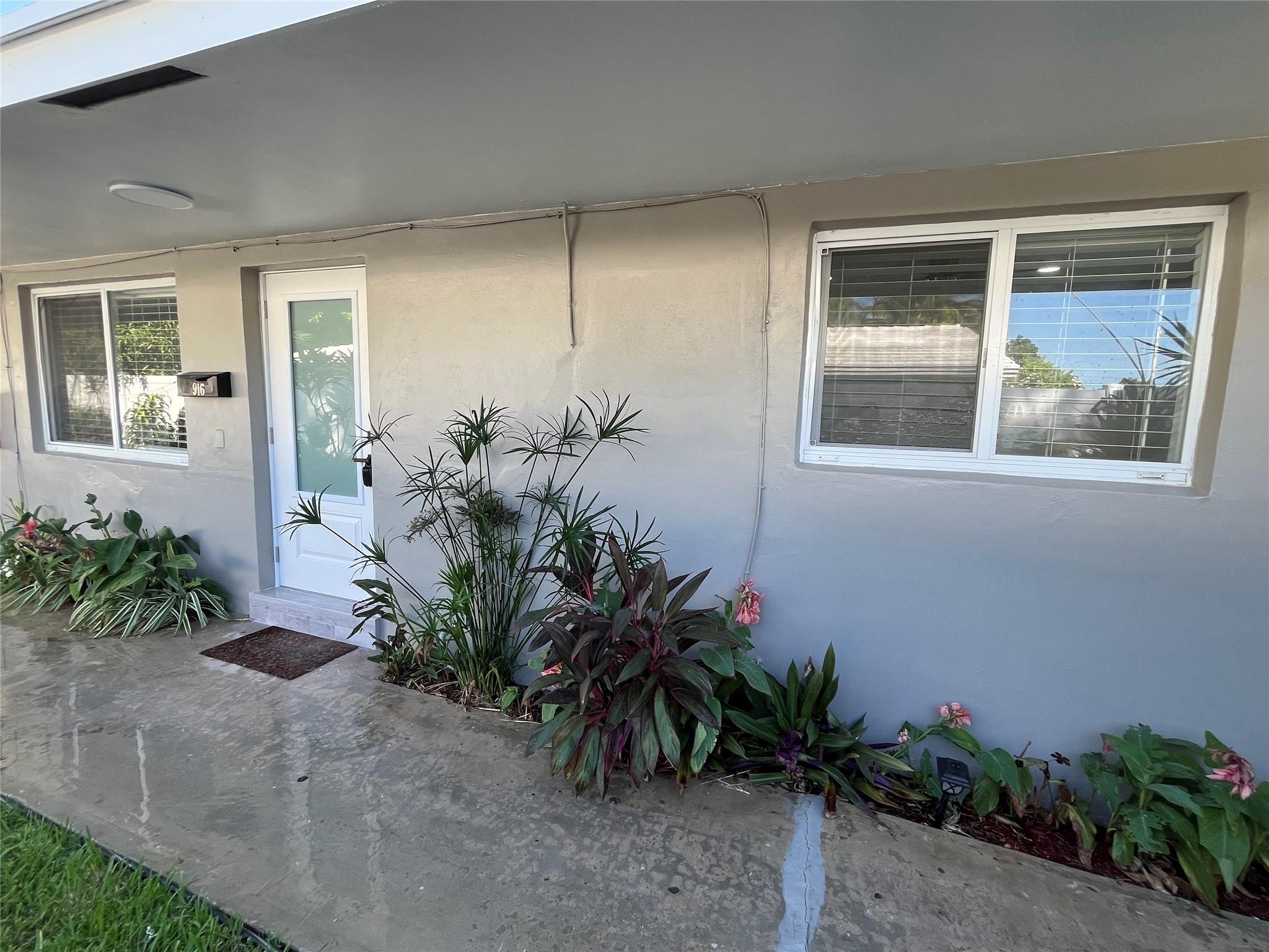READY FOR MOVE IN IMMEDIATELY! Want that Feeling of Living in a Single Family Home? Rent this unit located this Lush Residential neighborhood in Wilton Manors. This spacious two bedroom, one bath apartment is one half of a Duplex which is Completely Remodled. The entire unit has brand new wood grain tile flooring throughout. The open concept Kitchen has all stainless steel appliances and faces the living and dining area. One large bedroom faces the fully enclosed concrete tile patio. The other large bedroom faces the garden and driveway with large windows bringing in lots of Natural Light. This unit comes with two parking spaces and tenants must park in tandem if they have two vehicles. The third row of the driveway is reserved for visitors. Curious...? Come and See this one for Sure!