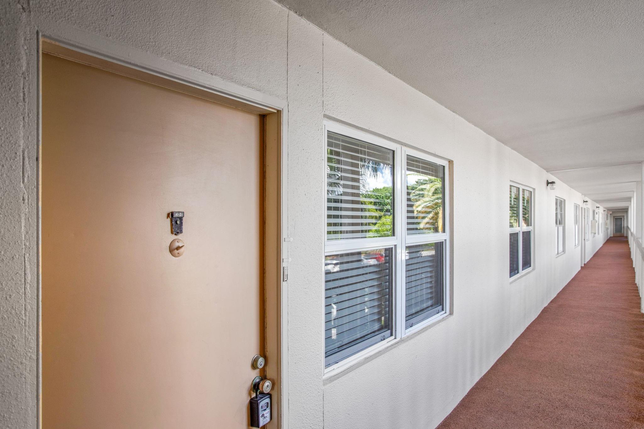 This beautifully renovated condo is exceptional. Enjoy hurricane impact windows, impact sliding glass doors in the living area and bedroom, as well as enclosed balcony with screens and acrylic windows. Key upgrades include A/C unit (2017) & water heater (2015). The modern interior features luxurious porcelain tile flooring, new baseboards, and remodeled bathrooms with contemporary vanities and custom shower doors. The kitchen is boasting white Shaker cabinets with soft-close doors, a pantry with pull-out drawers, stylish subway tile backsplash, quartzite countertops, LG stainless steel appliances. Enhanced by LED recessed lighting and smooth ceilings, along with a new electrical panel. This condo beautifully combines style, comfort. See All Photos Then See for yourself-55+