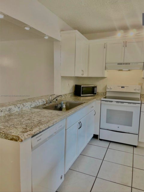 Tiny photo for 10581 ROYAL PALM Boulevard #10581, Coral Springs, FL 33065 (MLS # B26088164)