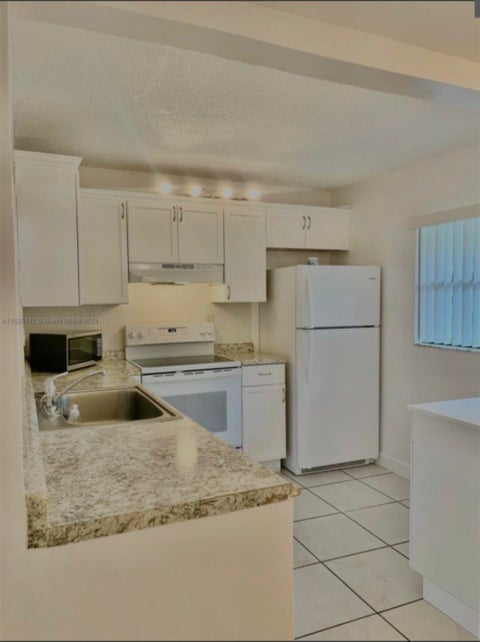 Tiny photo for 10581 ROYAL PALM Boulevard #10581, Coral Springs, FL 33065 (MLS # B26088164)