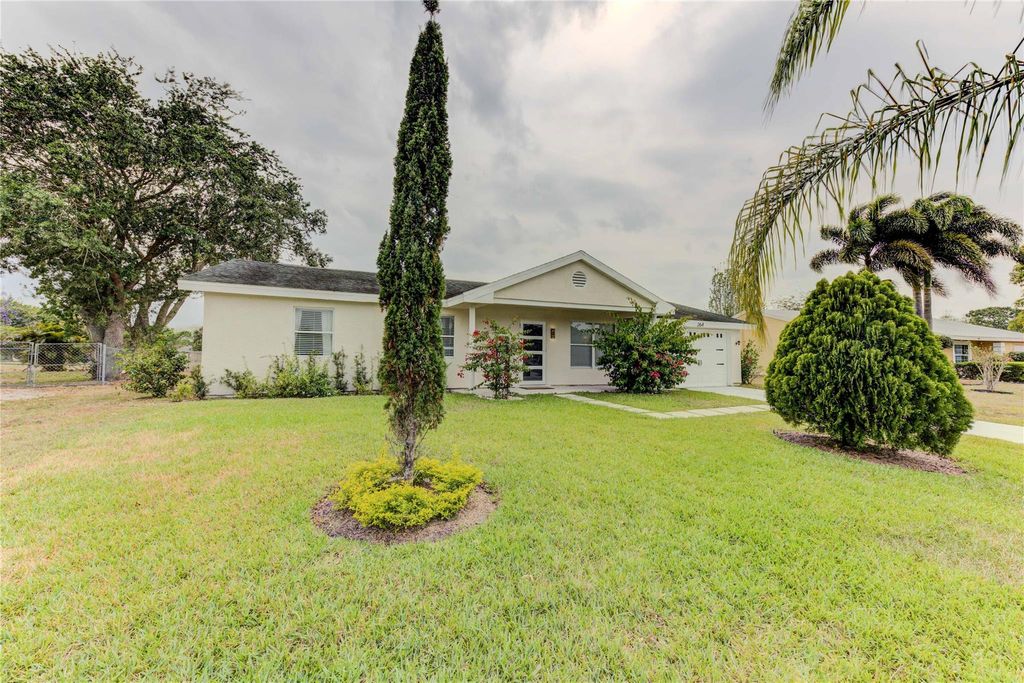 Photo of 264 SW Cherryhill Rd, Port St Lucie, FL 34953 (MLS # F10433885)