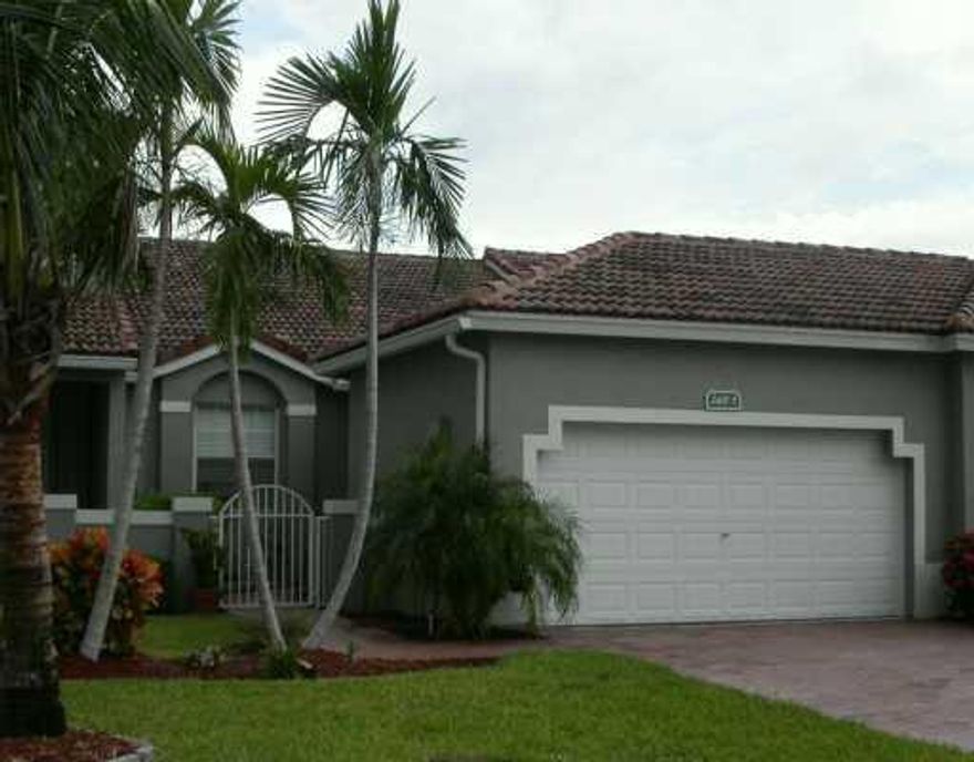 Come and see this Spacious 2/2 Villa home with its own 2 car garage. This Home boasts vaulted ceilings and with an open and airy floor plan. Enjoy the beautiful, serene lake view from your living room. The primary bedroom has a huge walk-in closet and Primary bath en-suite with dual sinks and a roman tub with a separate shower. The second bedroom is also spacious with a generous size bathroom and walk-in closet. Enjoy the convenience of having a separate laundry room with cabinets for storage. Enclosed patio to enjoy the lake and golf view with friends or your guests.