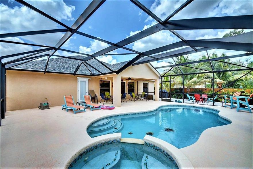 Envision Sitting Poolside, sipping your favorite beverage, listening to music, enjoying the Florida Sunshine & Tropical Landscape! Custom Pool built 2013 features screen enclosure, salt generator, color lights, heater, spa, & upgrades. Next to the pool is your private 'beach' to enjoy the games & firepit while grilling for family & friends. Backyard & pool are enchanting with landscape lighting. Inside, the family room opens to an oversized kitchen with granite counters, granite bar, ss appliances & plenty of cabinetry. Formal living & dining rooms afford additional space for office/den. Guest bath is a cabana bath. Add'l features: Brand-New roof in 2018, to the remodeled & expanded kitchen, to the custom master bath plus gutters, sprinkler on well, fence, wiring for generator. Call Today! Sizes and measurements are approximate, Buyer to verify all information please.