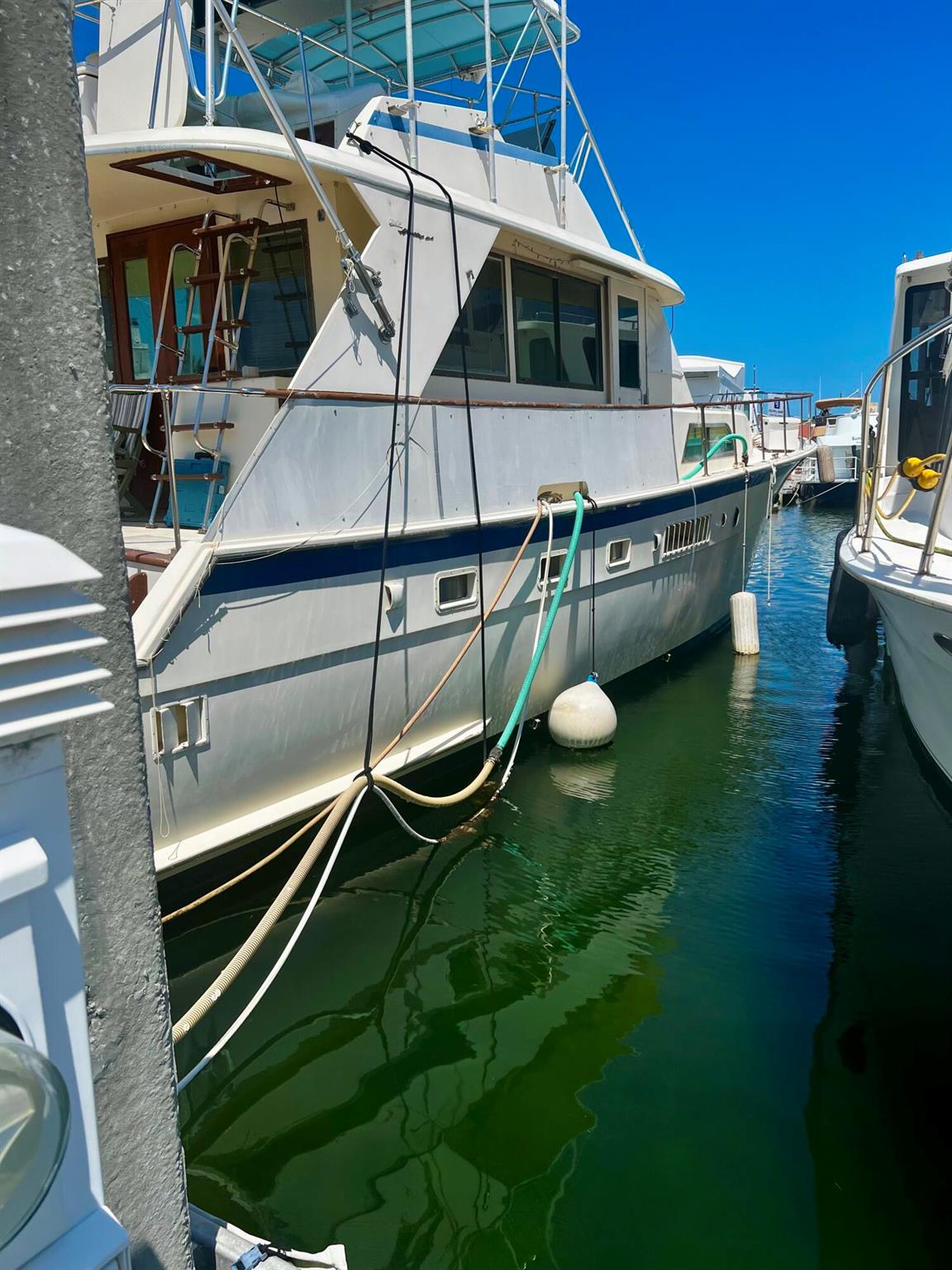 1978 53' HATTERAS ''Model Fish'' with twin Detroit Diesel Model 8V71N, 3 staterooms., 3 heads, 3 showers, galley, central air, generator. Rare 20' wide live aboard slip.THE HATTERAS 53 MOTOR YACHT IS A CLASSIC YACHTING DESIGN. FEW AMERICAN MOTOR YACHTS OF HER ERA CAME CLOSE TO MATCHING THE HATTERAS 53 IN COMFORT, LUXURY, AND NONE COULD MATCH THE QUALITY CONSTRUCTION LONG ASSOCIATED WITH THE HATTERAS BRAND. THE HATTERAS 53'S EXPANSIVE THREE-STATEROOM INTERIOR WAS CONSIDERED IDEAL IN A 1970s/1980s MOTOR YACHT HER SIZE. THE WHEELHOUSE IS OPEN TO THE SALON, AND A CENTERLINE DOOR LEADS TO A ROOM AFT DECK AREA. THE GALLEY IS DOWN SEVERAL STEPS FROM THE HELM/SALON AREA AND FEATURES LARGE COUNTER SPACES, ABUNDANT STORAG