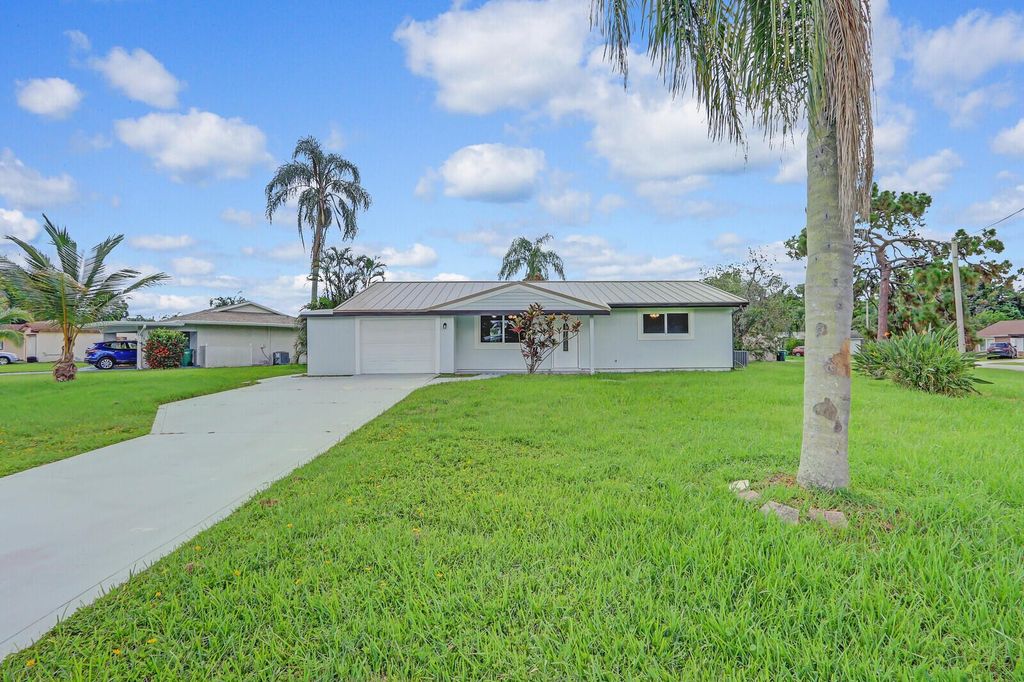 Photo of 119 SE Camino Street, Port Saint Lucie, FL 34952 (MLS # R11005427)
