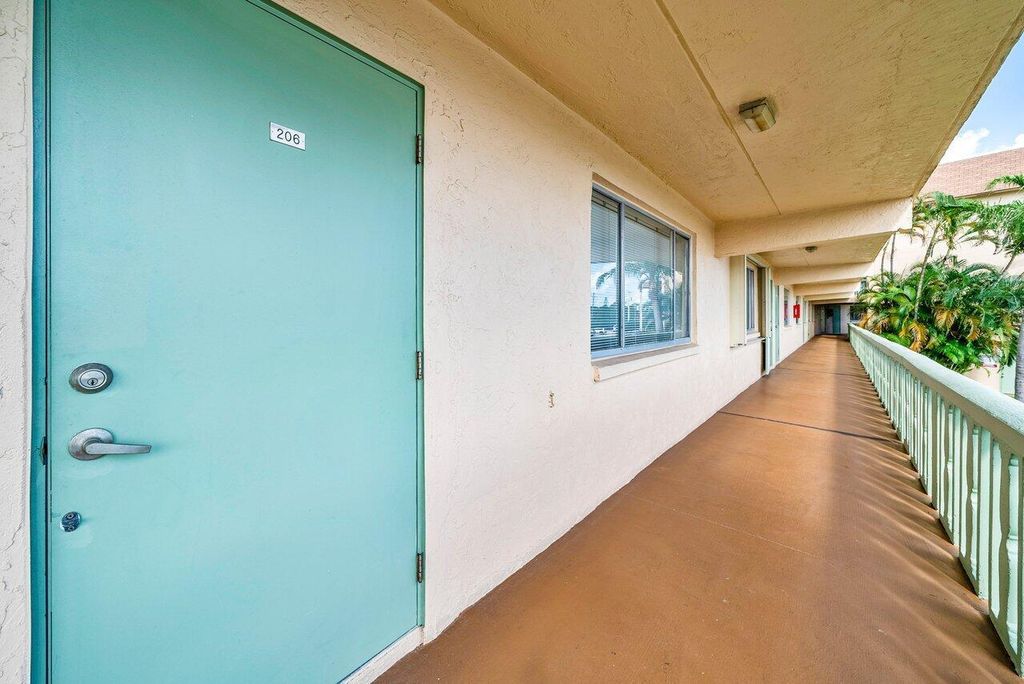 Photo of 300 Village Green Circle S #206, Palm Springs, FL 33461 (MLS # R11133713)