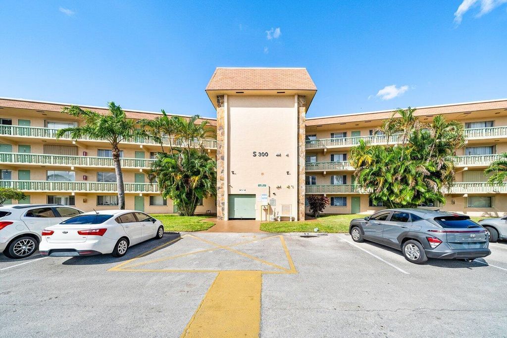 Photo of 300 Village Green Circle S #206, Palm Springs, FL 33461 (MLS # R11133713)