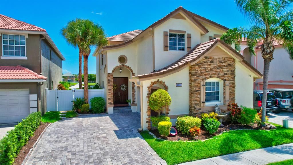 Photo of 6906 Spider Lily Lane Ln, Lake Worth Beach, FL 33462 (MLS # R10829354)