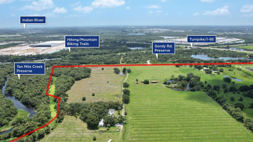 Attention Developers: 126 acres of one of kind property.  One mile from the turnpike entrance and less than two miles from the I95 entrance yet private. Over 1 mile adjoining the 855 acre 10 Mile Creek Reservoir,  approximately 1,600 feet on the 10 mile Creek Preserve and located across from the Gordy Rd County Preserve that features a fabulous 27 hole disc golf course along with hiking trails and picnic pavilions. Zoning is AG1 with future land use  of RS (two units per acre).The land is mostly cleared and high and dry  with lovely old oaks in patches and three lakes which offer built in views for the neighborhood. There are two very nice homes that each have their own guest cottage. Ideal for the owner who wants to have homes to rent out or use during development of the property.