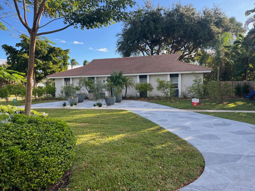 Photo of 7598 W Country Club Boulevard, Boca Raton, FL 33487 (MLS # R11141542)