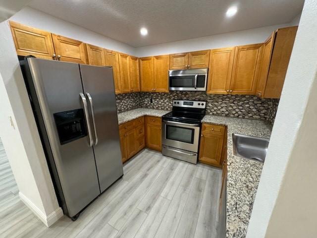 Welcome to this spacious, move-in–ready 2-bedroom, 2-bath apartment nestled in a friendly, prime-location community—no association approval required! The generous master suite includes a private, recently refreshed bathroom, while a second modern bath serves your guests. The eat-in kitchen delights with granite countertops, stainless steel appliances, and elegant cabinetry—perfect for daily meals or entertaining. Throughout the unit, fresh paint, recessed lighting, and hurricane-impact windows enhance both comfort and energy efficiency. Utilities include water, and the apartment is available for immediate occupancy.