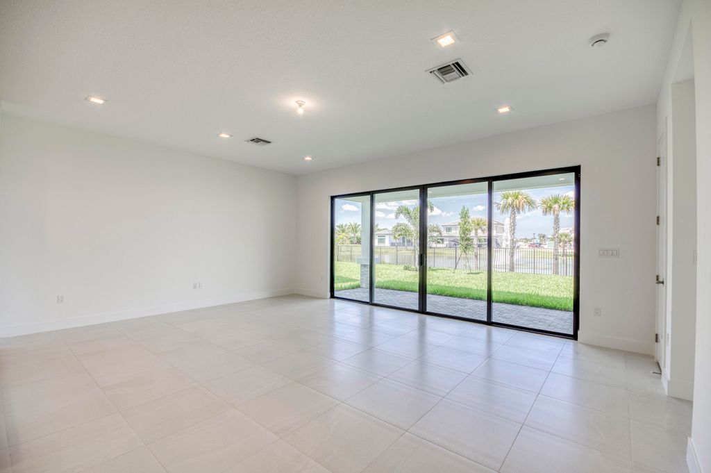 Photo of 10037 Heron Flock Drive, Palm Beach Gardens, FL 33412 (MLS # R11047349)