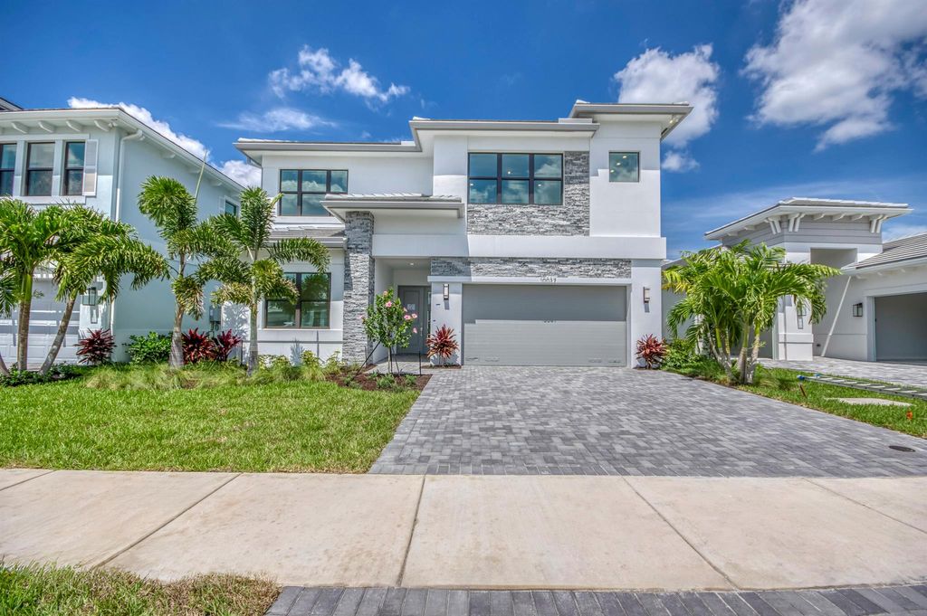 Photo of 10037 Heron Flock Drive, Palm Beach Gardens, FL 33412 (MLS # R11047349)
