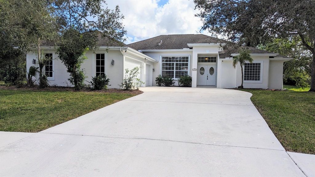 Photo of 1990 SW Justison Avenue, Port Saint Lucie, FL 34953 (MLS # R10933173)