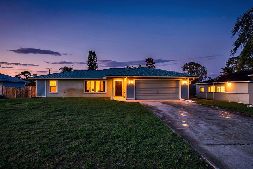 Welcome to this beautifully maintained 3-bedroom, 2-bathroom home with a bonus room that perfectly combines comfort, style, and peace of mind. This move-in ready property features numerous recent upgrades, including a new roof (2025), AC (2022), water heater (2022), and complete impact glass windows installed in 2023, offering both efficiency and storm protection.  Step inside to find diagonal tile flooring throughout the main living areas and vinyl flooring in the bedrooms, creating a clean and modern feel. The kitchen is a standout with quartz countertops and a matching quartz backsplash, giving the space a sleek, updated look. The kitchen also comes equipped with updated appliances. Large windows allow for abundant natural light, making the home feel bright and inviting. Outside, enjoy a spacious fenced-in backyard, perfect for entertaining, pets, or relaxing in privacy. The storage shed is included, providing extra space for tools, hobbies, or outdoor equipment.  Located in a highly desirable area, this home offers convenience to shopping, dining, and everyday amenities while providing a comfortable place to call home.  Don't miss the opportunity to own this well-updated and beautifully cared-for property!