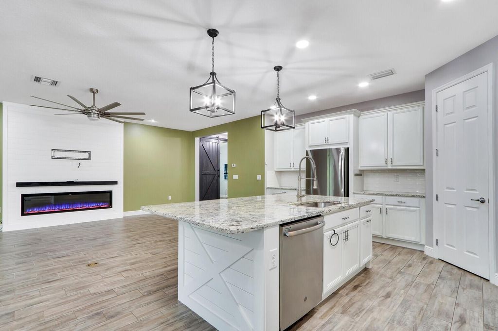 Photo of 10342 SW Ligustrum Drive, Port Saint Lucie, FL 34987 (MLS # R10986210)