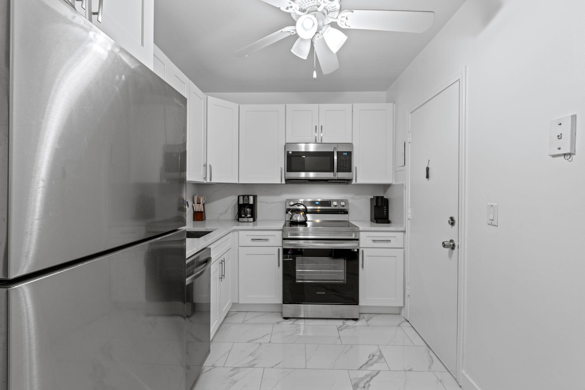 Welcome to beautifully remodeled full 2bed/2bath 2nd-floor corner unit offering an exceptional privacy with the largest floor plan. This spacious condo features a modern open layout, brand-new stainless steel appliances, updated kitchen and bathrooms, new A/C , new water heater, and sleek flooring throughout. Enjoy added comfort and privacy with darkening roll blinds and curtains on all windows. No assessments, low HOA fees, and located in a well-maintained like home community just minutes from the beach, shopping, and dining. Move-in ready and perfect for a primary residence or investment! Active Adult Community with plenty of amenities and activities: park-like walking areas, large HEATED swimming pool, laundry facilities, clubhouse, library, BBQ/picnic areas..