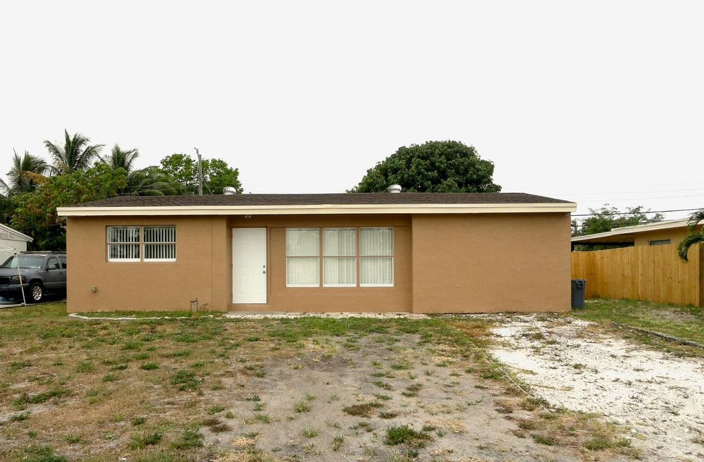 Photo of 465 Waseca Drive, Lake Worth, FL 33462 (MLS # R10987889)