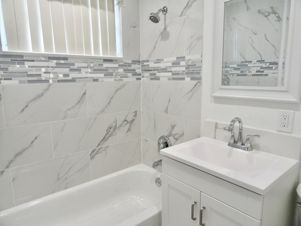 Photo of 465 Waseca Drive, Lake Worth, FL 33462 (MLS # R10987889)