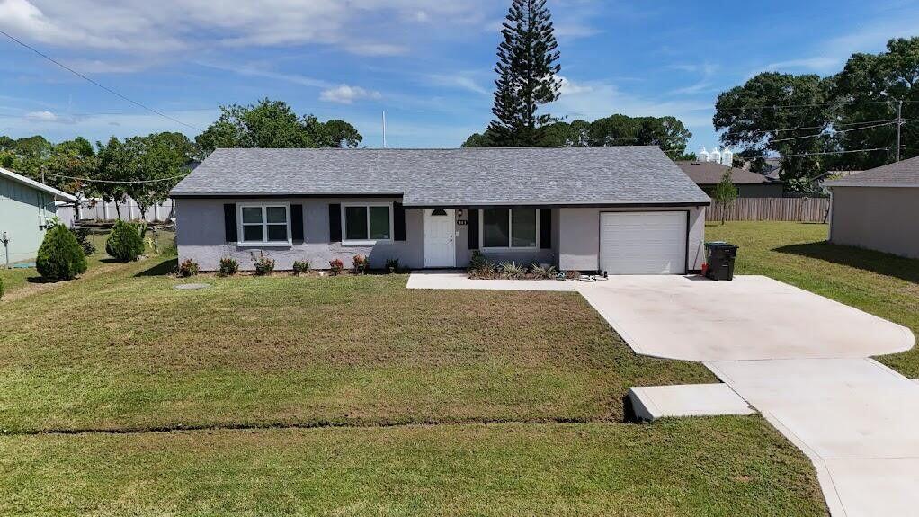 Totally renovated, new windows, roof only acouple years old. open floor plan, with stainless steel appliances. Three bedrooms, two baths with one car garage. Fenced in backyard. Centrally located close to I-95 and turnpike for commuting. Close to park and restaurants. Within 20 minute drive to the BEACHES and Jensen Beach Mall