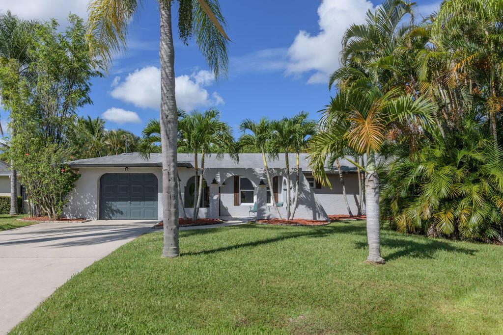 Gorgeous three bedroom two bath beach bungalow. Located blocks from the boat ramp and close to the beach. Desirable location and quiet neighborhood. Real hardwood floors and impact windows all the way around except back room. Freshly painted and ready to move in today.