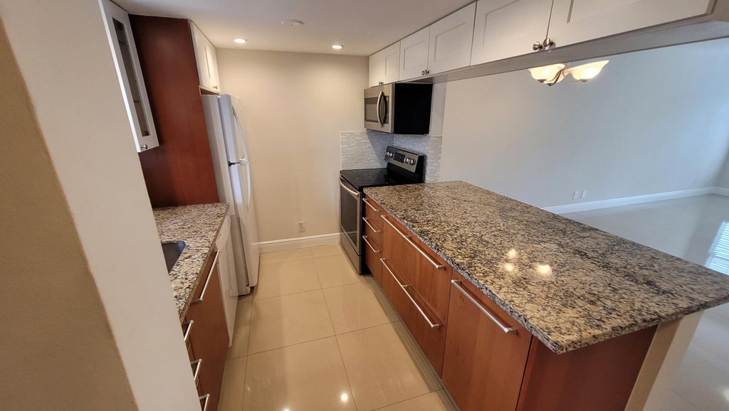 Photo of 6283 La Costa Drive #F, Boca Raton, FL 33433 (MLS # B26073050)