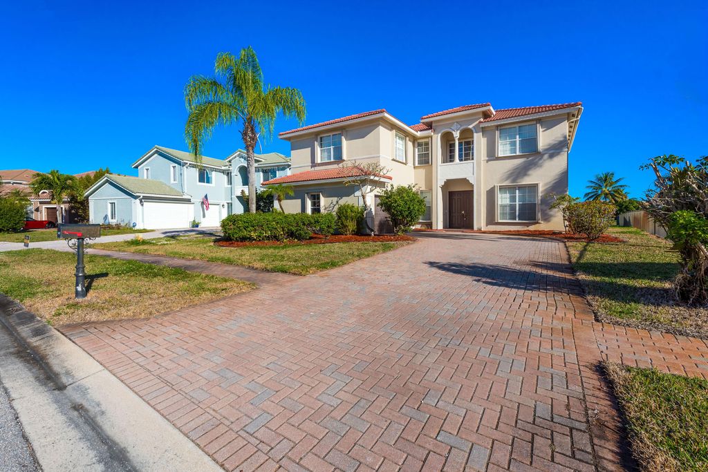 Photo of 102 Ibisca Terrace, Royal Palm Beach, FL 33411 (MLS # B26008902)