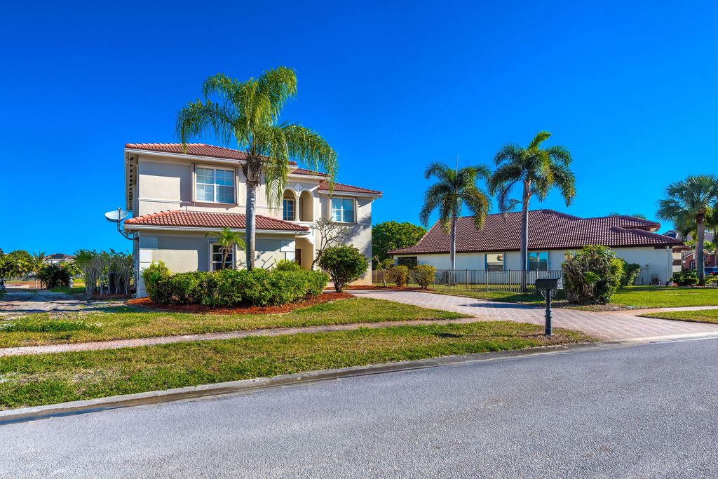 Photo of 102 Ibisca Terrace, Royal Palm Beach, FL 33411 (MLS # B26008902)