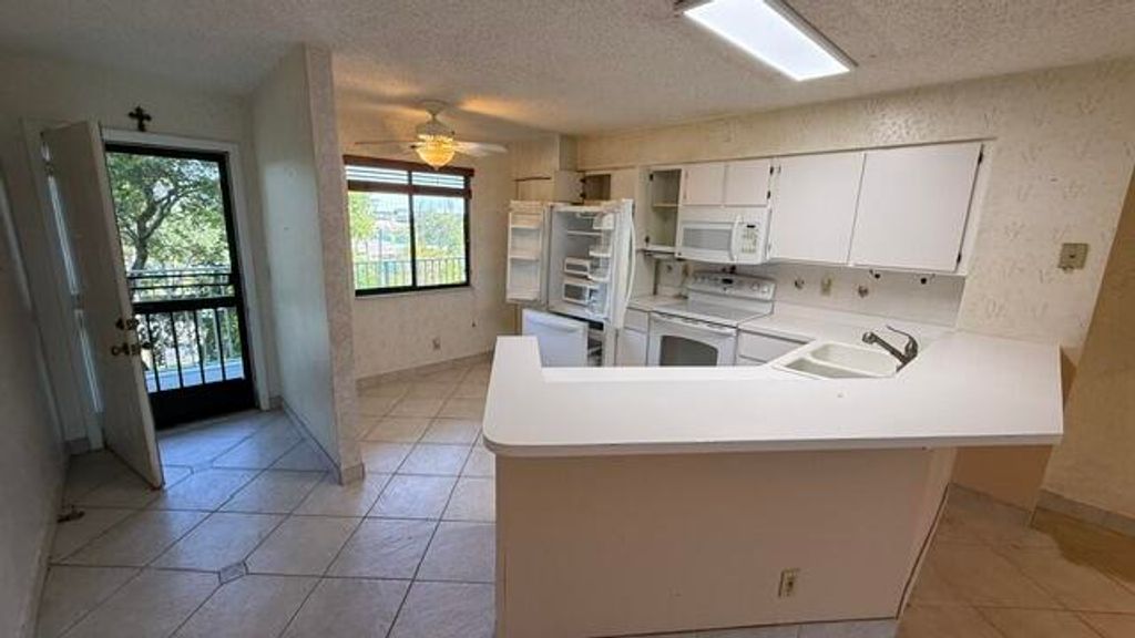 Photo of 2238 N Cypress Bend Drive #406, Pompano Beach, FL 33069 (MLS # B26021633)