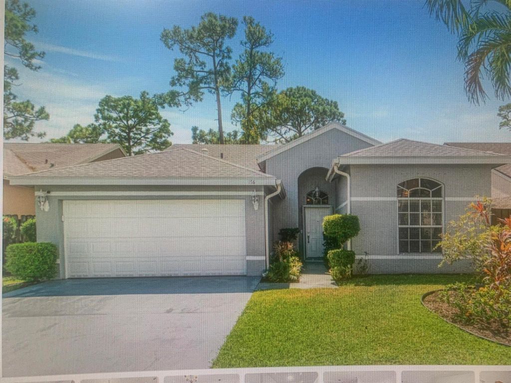 Photo of 176 Heatherwood Dr, Royal Palm Beach, FL 33411 (MLS # R11022281)