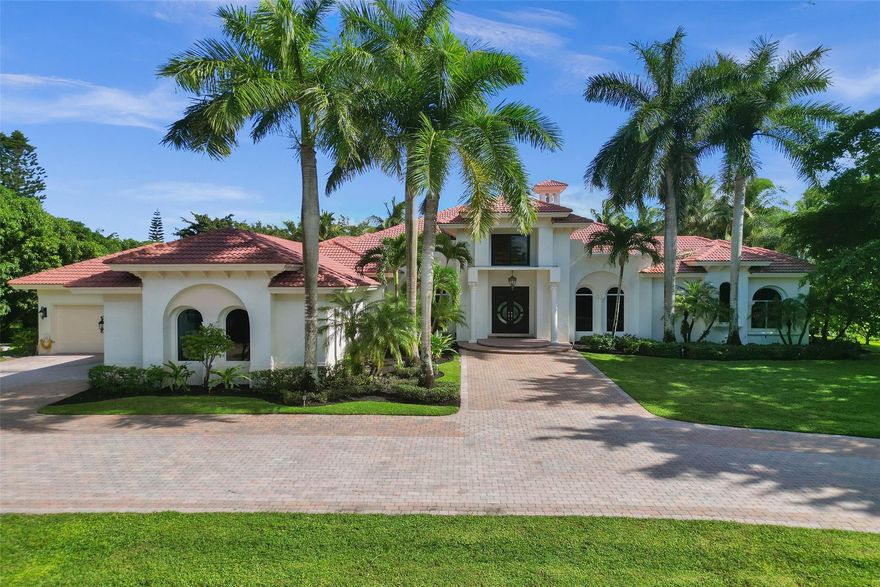 Welcome to an exceptional estate in the exclusive Rio Poco community of Delray Beach. This stunning residence offers 6 bedrooms, 5.5 bathrooms, and a library/den, all situated on a lush, private 1-acre lot with serene lake views. The home showcases exquisite custom woodwork, elegant marble floors, and impact windows, creating a luxurious and timeless ambiance. Outside, a sparkling pool invites relaxation and entertaining in a tranquil, secluded setting. Rio Poco is renowned for its prestigious estate homes, offering residents privacy, security, and a refined lifestyle. This property is a rare gem in a prime location—experience the exceptional.