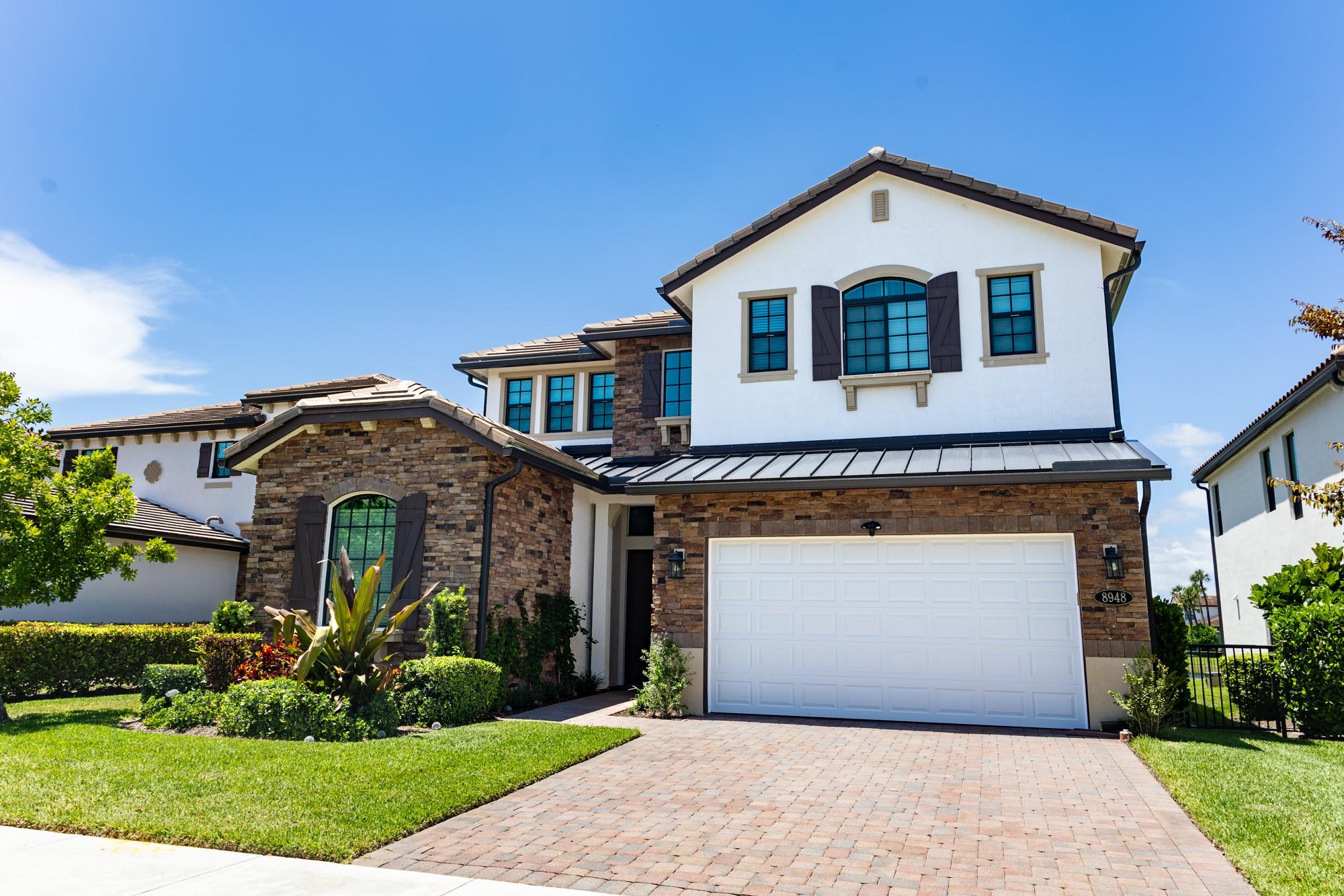 Experience refined living in the desirable Palm Meadows. This nearly new residence features a modern open-concept layout w/ large master on the main floor. Enjoy beautiful lake views from expansive living areas & unwind on electric controlled screened lanai in backyard ideal for relaxing or entertaining outdoors. The gourmet kitchen is equipped w/ premium appliances, gas cooktop, & elegant dining area. The garage is climate-controlled w/ mini split system, offering comfort for hobbies, storage, or additional workspace. Great upgrades throughout inc under-stair storage, HVAC UV lights, hurricane impact windows & doors, & fenced backyard w/ ample space to add a pool. Also enjoy access to outstanding community amenities, inc a resort-style pool, clubhouse, fitness center, tennis courts & more
