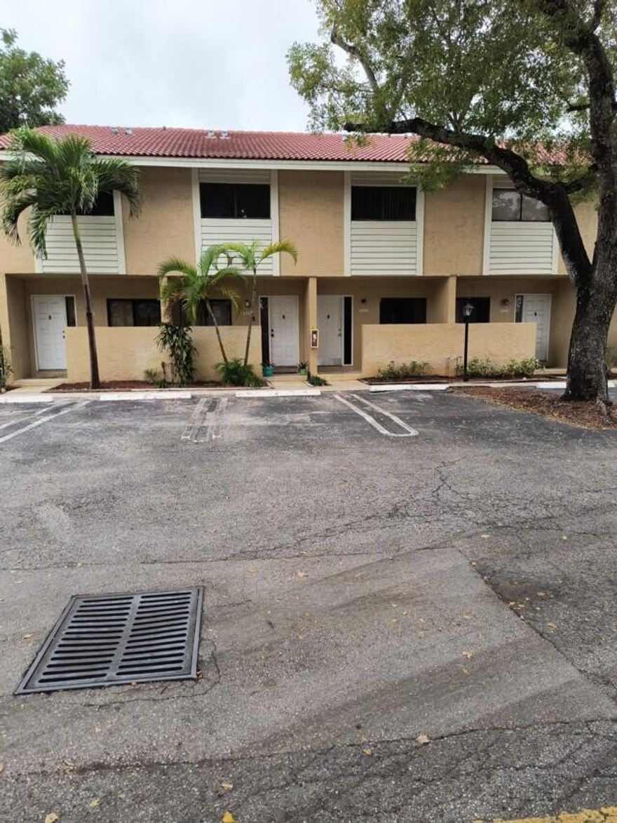cozy 2 Story Townhouse with 2 beds 1.5 baths in the heart of Coral Springs. Laminate on first floor plus washer and dryer in unit. Small patio at entry way. Central A/C and ceiling fans. close to strip mall, public transportation and sawgrass express way.