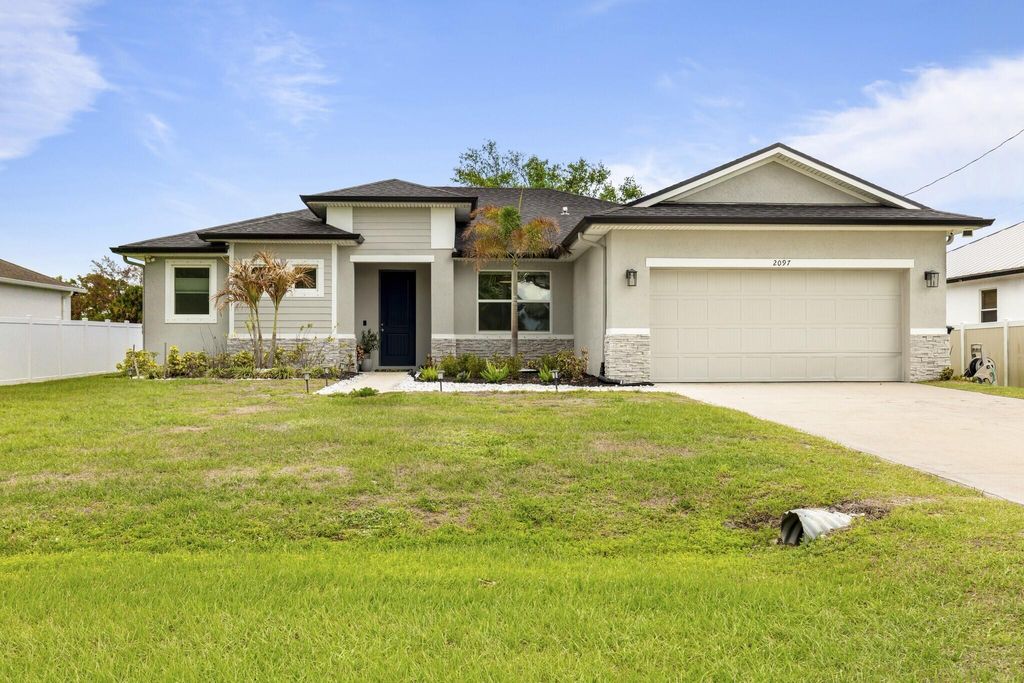 Photo of 2097 SW Import Drive, Port Saint Lucie, FL 34953 (MLS # B26004183)