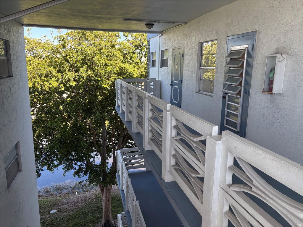 Photo of 4050 NW 42nd Ave #415, Lauderdale Lakes, FL 33319 (MLS # F10541330)