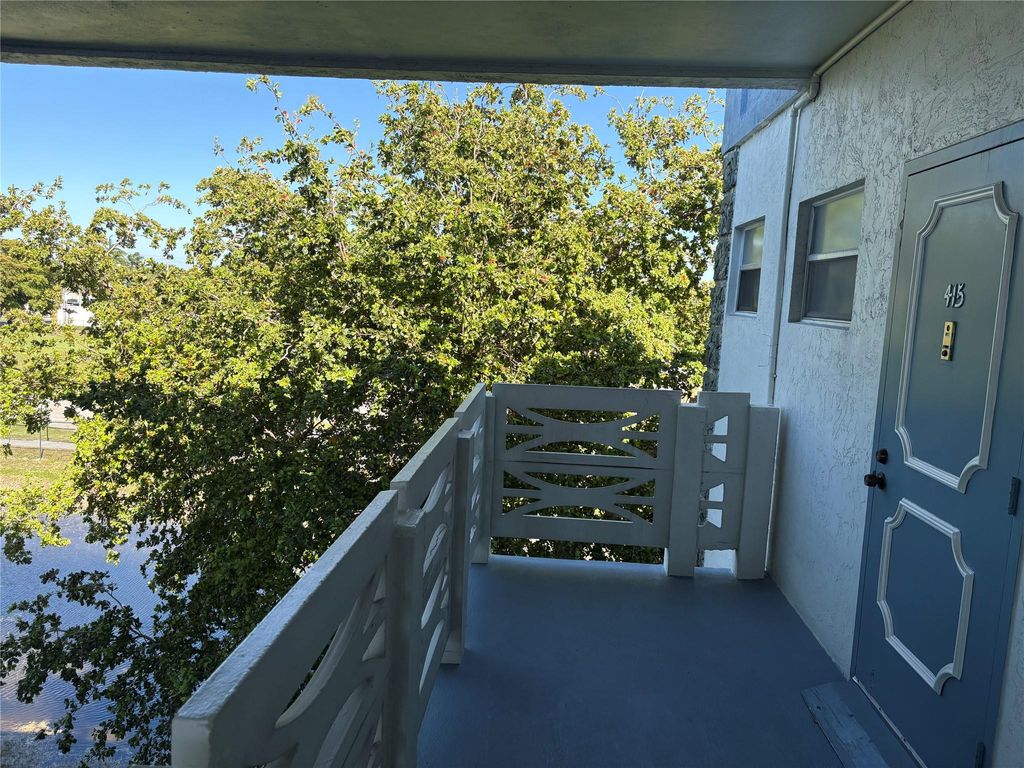 Photo of 4050 NW 42nd Ave #415, Lauderdale Lakes, FL 33319 (MLS # F10541330)