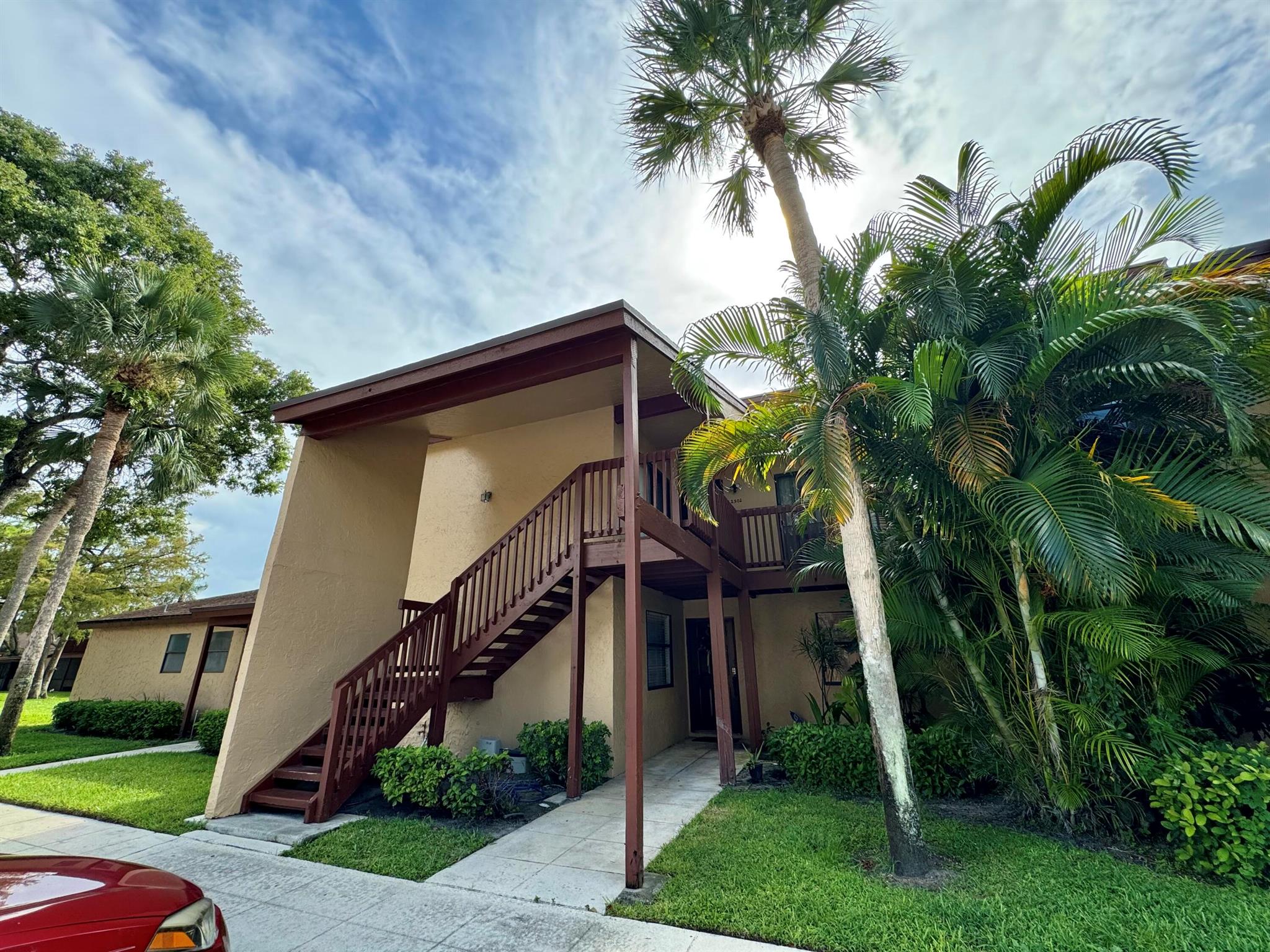WELCOME HOME to this 2 bedroom 2 bathroom 2 story condo in the highly sought after family oriented community Trails at Royal Palm Beach! This is a fantastic opportunity, ready for your personal touch, a blank canvas with endless potential. Buy it at a great price, renovate it to your style, and create your own private retreat.The property features a magnificent central view of the community pool and amenities from of your back screened patio. This home boasts a large open kitchen with plenty of cabinetry and a washer and dryer inside the unit. This two story condo features vaulted ceilings, and an abundance of natural light throughout. Enjoy the great crossflow breeze from the front door to the screened back patio, including a private front patio entrance, and a back screened