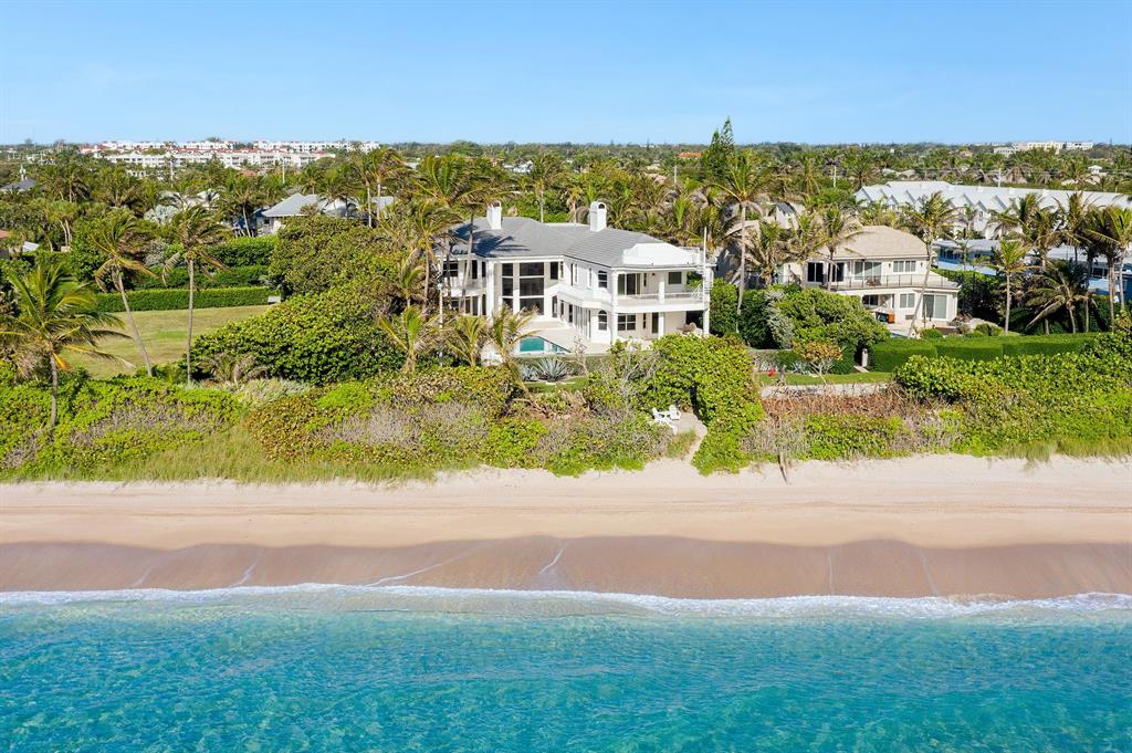 Oceanfront estate home on 3/4 acre including 100' x 124' ft direct oceanfront parcel. The residence is perfectly sited on a privately owned cul de sac east of A1A. Enter through the gated motor court, double mahogany grand front doors lead to the light filled living room & expansive ocean views. A spacious kitchen, complete with chef-quality appliances is wide open to the family room & more ocean vistas. The first floor has 2 large guest suites. Upstairs the enormous Master suite encompasses a sitting room with fireplace, expansive bath, immense closet, safe room and tremendous ocean views. A private loggia off the master is the ideal spot for watching the waves. Three more en suite bedrooms complete the 2nd floor including a separate suite ideal for in-laws or nanny and home office.