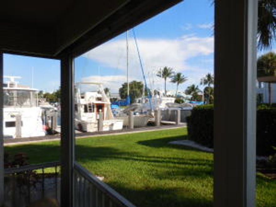 MARINA WATER VIEWs from this 1st floor, Corner Unit! Walk directly out your east facing patio with private green area to the Marina. Bring your decorating ideas and renovate this unit to your taste. 2012 AC, ACCORDIAN SHUTTERs. WASHER/DRYER HOOKUP inside the unit. Unit comes with covered carport space and storage locker!   Community offers 3 heated pools, 2 clubhouses (saunas, weight area, community room) and BOAT DOCKAGE! Boat dockage at 29' & 50'(20-40' boat ok!).  Only $11/ft plus elec + H2O...for the year! Association fees include cable/water for the​​‌​​​​‌​‌​​​‌‌​​​‌‌‌​​‌​​‌‌​​​​ unit.