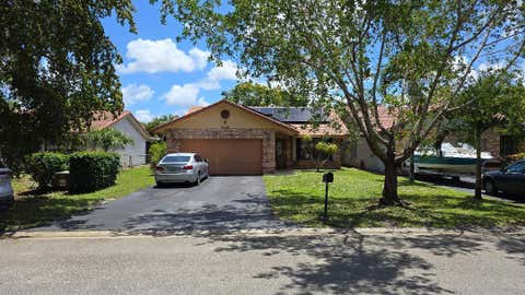 Photo of 2499 NW 92nd Avenue, Coral Springs, FL 33065 (MLS # B26032289)