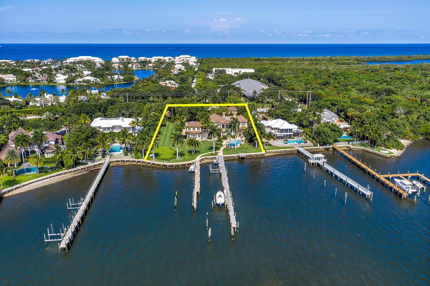 BEST YACHT DOCKAGE!  Magnificent 14,000 SF modern villa on Largest Intracoastal parcel in North County. 1.52 Acres + 225' of private wide-water frontage w/ 2 Docks + 215' boat slip.  Impeccably constructed with premiere Hurricane Impact Windows/Doors + full house Generator, this custom residence boasts grand scale rooms that are formal yet comfortable + inviting. Design elements include Jerusalem stone + wood floors, beamed ceilings + custom doors. Additional rooms include a gym, media room, office + 1500 bottle wine cellar. Chef's kitchen opens to light filled family room, perfect for gatherings. Luxe master suite w/ Huge covered lanai, sauna + 2 room sized closets. Enchanting  outdoor space w/ lush landscaping, putting green, grand Boat house + pool w/ spa.  Heavy duty seawall + IPE dock Bonus wing of this home was built in 2007.  Enjoy the finest in Florida living in one of the Palm Beaches' most coveted locations, East of US One by PGA Boulevard.  Boaters will understand the value of being within easy access the areas PREMIERE (Palm Beach) Inlet, designed for easier + smoother Ocean access.  North Palm Beach residents enjoy true Village living in a seaside enclave with its own Country Club (Beautifully renovated in 2019), featuring a signature Jack Nicklaus course built along the Intracoastal waterway as well as league tennis and an Olympic sized swimming pool.  Minutes from world class shopping, dining, educational and cultural venues.   3 major airports all within one hours drive.   Enjoy No State Income tax and a healthy + beautiful lifestyle in one of South Florida's best kept secrets... North Palm Beach!
