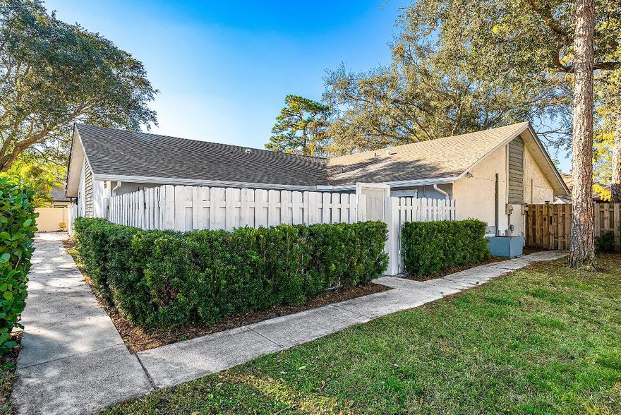 Located in the heart of Wellington, this well-maintained corner-unit villa in Sugar Pond Manor offers comfortable single-story living with tile flooring throughout and vaulted ceilings that enhance the open, airy feel. The home features an updated kitchen, new impact sliding glass doors, and a 2024 shingle roof with gutters, providing peace of mind for the next owner. Enjoy outdoor living in the fenced front courtyard/patio, ideal for relaxing or entertaining. Conveniently situated near Wellington's polo grounds and equestrian venues, as well as shopping, restaurants, and retail centers. No HOA, no rental restrictions, and financing options include Cash, Conventional, FHA, and VA—making this an excellent primary residence, second home, or investment opportunity.