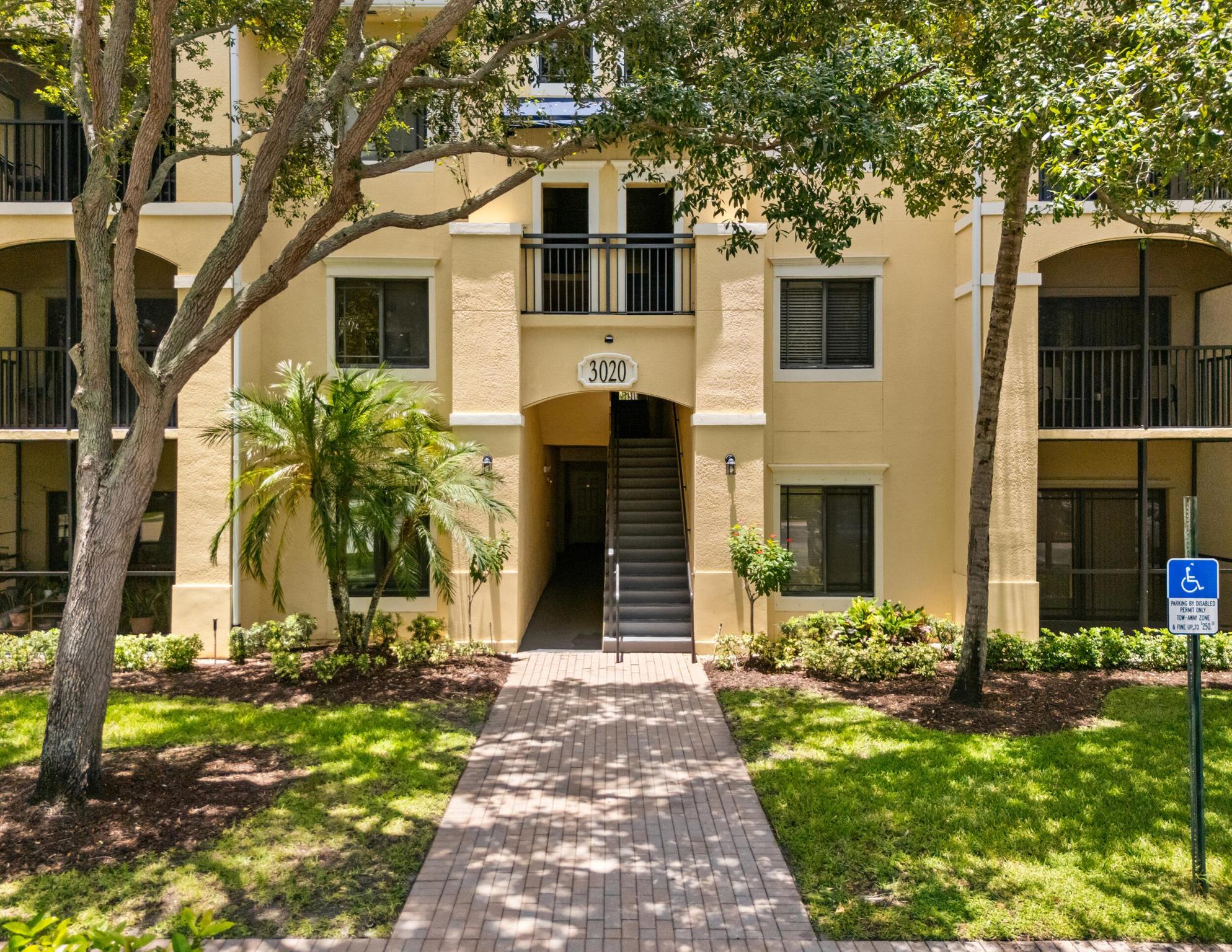 Welcome to this spacious 3-bedroom, 2-bathroom home conveniently located on the first floor in the beautiful community of San Matero in Palm Beach Gardens. This inviting residence features a desirable split floorplan with new plush carpet in the main living area, and carpet in bedrooms offering both comfort and warmth. The updated kitchen is complete with brand-new cabinetry, sleek quartz countertops, a convenient bar top for casual dining, and a pantry for extra storage. Enjoy the ease of an in-unit laundry area and ample closet space throughout the home. Walk out to the spacious screened in back porch and enjoy the garden view. San Matero offers a resort-style lifestyle with outstanding amenities, including a clubhouse with table tennis and a billiards table, tennis & pickleball courts,