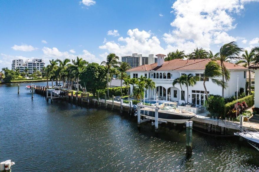 This exquisitely renovated home, boasting a seven-figure investment from interior to exterior, features a brand new cement tile roof installed in May 2024. Come sit by the pool and watch the boats pass by, as this home is just one lot off the Intracoastal waterway. Nestled on 100' of waterfront within the prestigious Tropic Isle community, 955 Iris Drive features over 7,700 sqft of living in Delray Beach and offers an unparalleled living experience. This meticulously renovated residence effortlessly harmonizes classical grace with contemporary refinement, showcasing impeccable craftsmanship and taste. In Delray Beach, this 5-bedroom, 5.1-bathroom home with 7,727 square feet is indeed a rare find. Upon entering the formal foyer, guests are welcomed into a spacious great room with soaring ceilings and expansive windows that flood the interior with natural light.  A floor-to-ceiling stone fireplace adds a touch of warmth and grandeur to the space. A new epicurean kitchen, suited to the best of chefs, offers top-of-the-line cabinets, two large islands, quartz countertops, a butler pantry with access to a large dining room, Viking appliances, and a six-burner gas stove top. Adjacent to the kitchen is a spacious and inviting gathering room with a custom built in entertainment center, and a breakfast area with picturesque water views that seamlessly connect to the pool/patio area, spa, and outdoor summer kitchen creating an oasis of relaxation. The first floor also accommodates a private office, a fitness space, and an elegantly designed guest suite with direct access to the pool area, offering stunning water vistas.

The second floor features four bedrooms including three guest suites and a loft area. The grand owner's suite includes a spacious sitting room, his/her spa-like bathrooms, two walk-in closets, a separate shower, and a tub bringing a sense of Zen within its doors. Complementing the owner's suite is a beautiful balcony with breathtaking views of the direct Intracoastal and inviting gentle coastal breezes. Additional features of this exceptional home include a 3-car garage, an elevator, two laundry rooms, marble and wood floors, and a dock with a 20,000-pound boat lift, electrical panel, and shore power outlets. A home to be proud of located only moments to a cornucopia of fine restaurants, boutiques, and lively entertainment along famed Atlantic Avenue and minutes to Boca Raton. For homebuyers eager to begin living "the good life" on the water, this is a coveted and rare offering.   For discerning homebuyers seeking the epitome of the good life, this offering is truly one-of-a-kind and not to be missed.