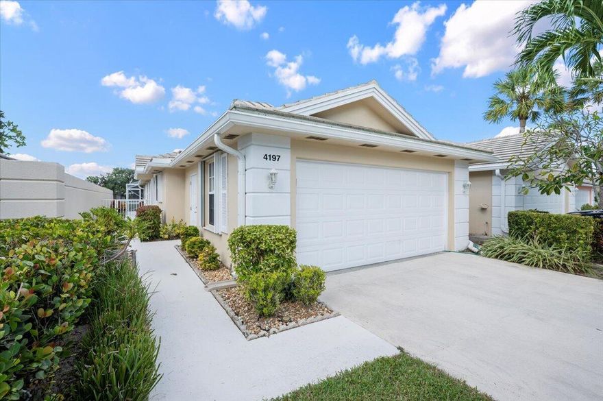 Private lakefront beauty on tree lined streets with sidewalks in Garden Oaks  (24/7 manned gated community) A rare find--this pet-friendly home radiates charm, comfort, and tranquility. You'll love the open kitchen with granite countertops, stainless steel appliances, and solid wood cabinetry. Spacious layout with huge living room, den, and two separate bedroom suites in desirable split plan. Relax on the expansive screened patio with large covered section. Private fenced yard--perfectly positioned for peaceful lake views and awesome sunset views. Separate Laundry room with wet sink, Central vacuum, ADT, large 2-car garage. Rate includes FPL of $125* Monthly*FPL allowance (10,000 kWh/year). Minutes to shopping, dining, beaches, golf, I-95 and Turnpike.