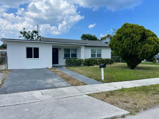 A well maintain single family home for rent in centrally located beautiful Riviera beach. Property is just minutes away from Singer Island beach and is centered around a lot of stores, dining, attractions and much more. This 3-bedroom home features recent upgrades of the kitchen and bathrooms, waterproof laminate floors throughout the home and large size back yard great for entertainment