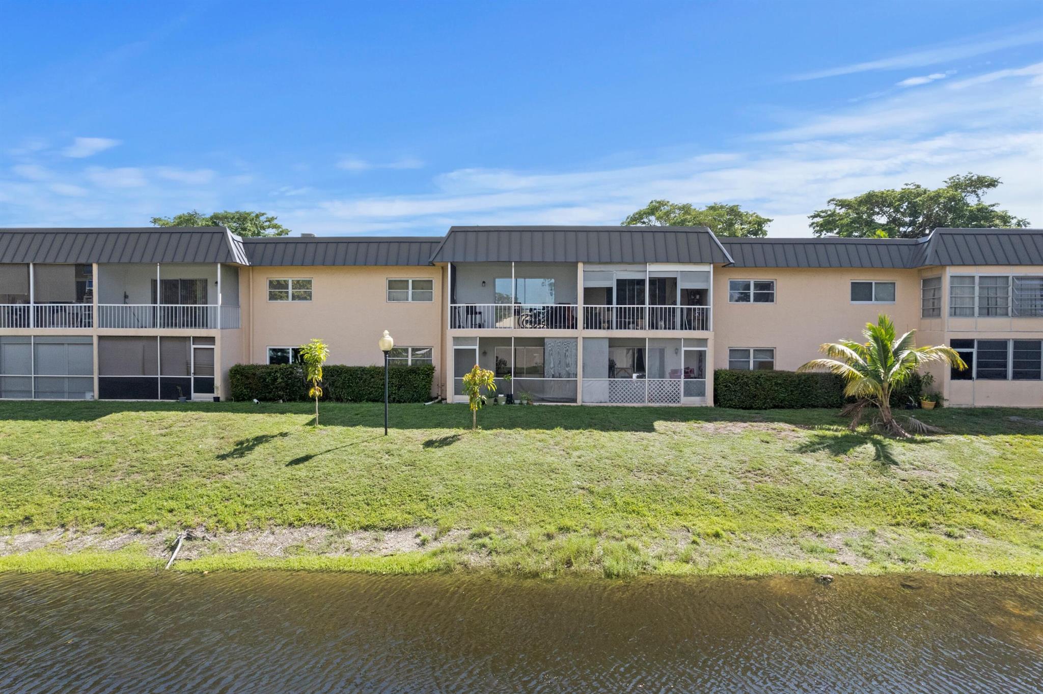 RARE INVESTOR OPPORTUNITY | RENT RIGHT AWAY | ABSOLUTELY GORGEOUS WATERFRONT CONDO | PRESTIGIOUS SANDALFOOT SQUIRE | BREATHTAKING CANAL VIEWS | WALK TO POOL | NEW 2025 METAL ROOF | LOW HOA FEES | 1st Floor | Bright Open Floor Plan | LED Lighting | Tile Floors | Tray Ceilings | Private Screened Patio | Eat-In Kitchen | Serving Window | Granite Backsplash & Counters | White Wood Cabinets | New Fridge 2017 | Large Primary Bedroom, En-suite | Assigned Parking Directly in Front of Unit | Additional Guest Parking | Amenities offer, Community Pool, Clubhouse, Tennis Courts, Laundry Room & so much More! Prime Boca Location, Minutes to Beach, Mizner Park & Delray Beach Atlantic Ave | Top A+ Rated Schools | AC 2015 | Roof 2025 | WH 2016 | ASSESSMENT PAID IN FULL BY THE SELLER | PRESENT ALL OFFERS