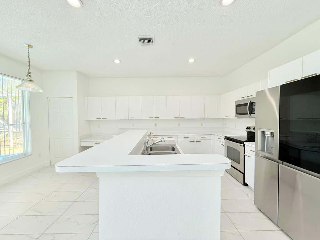 Photo of 10875 Old Bridgeport Lane, Boca Raton, FL 33498 (MLS # B26049735)
